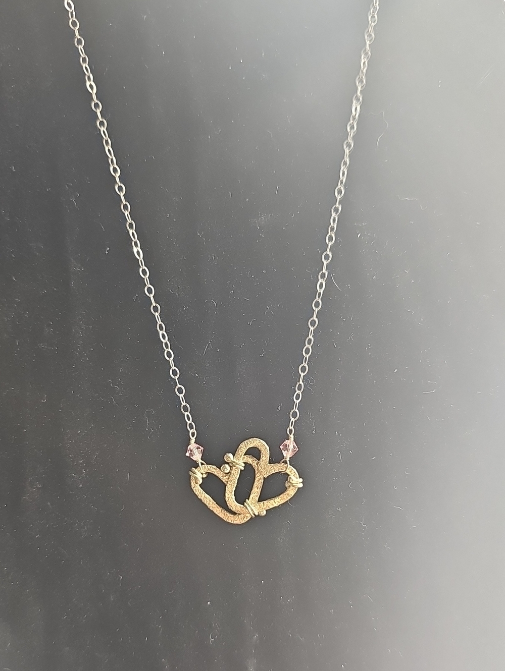 Silver double Heart Knot Pendant Necklace with Pink Crystal Accents